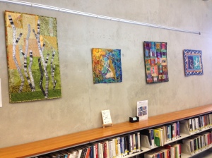 textile art displayed on wall